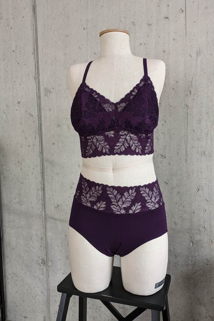 Photo of a bust with custom-made bra and underpants in purple.