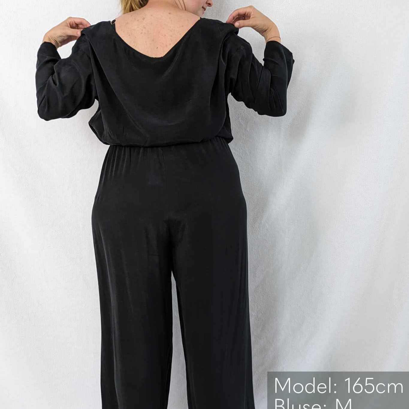 Woman is barefoot and wears comfortable pyjamas