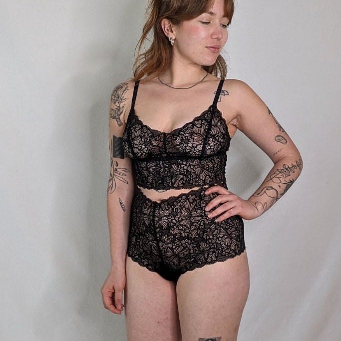 The model wears the finest underwear with lace from Italy and light support