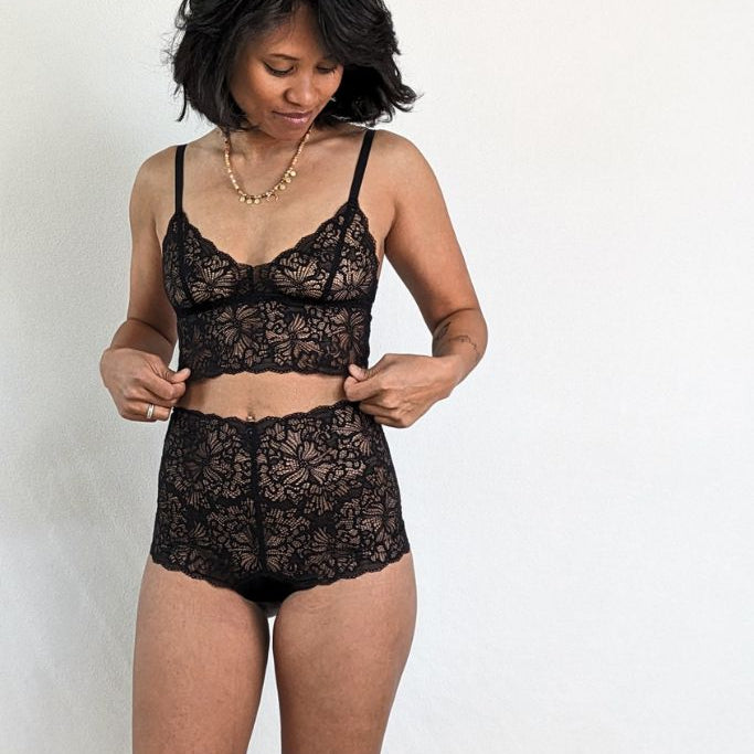 the woman wears the beautiful Joy set and puts on the Bralette .