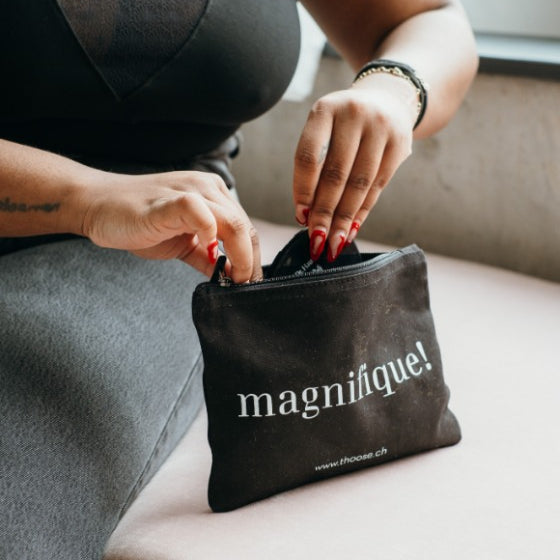 the model takes something out of the cosmetics bag