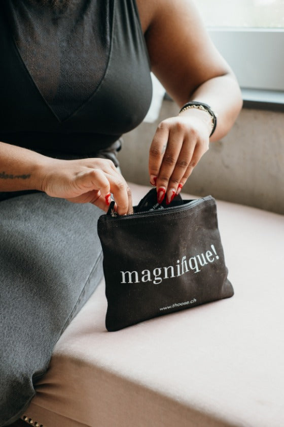 the model takes something out of the cosmetics bag