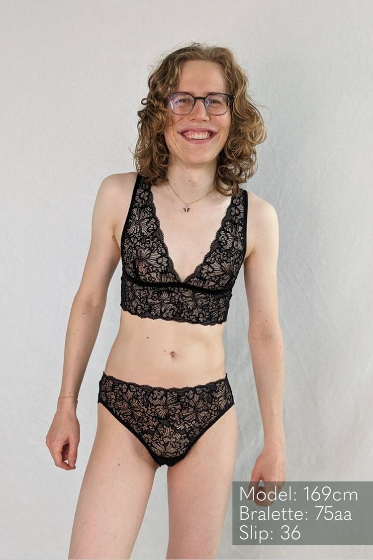 Cheerful person in black lace lingerie belle.