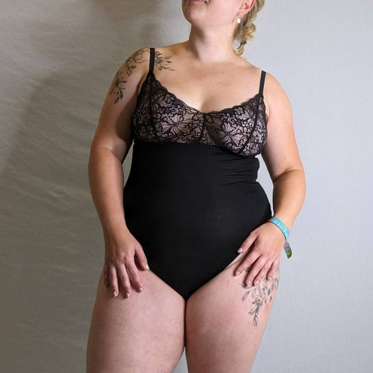 Woman wears Body with romantic lace.
