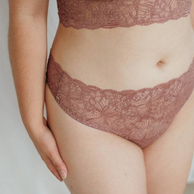 Close-up of Sting Belle in smockey rose on white skin. 