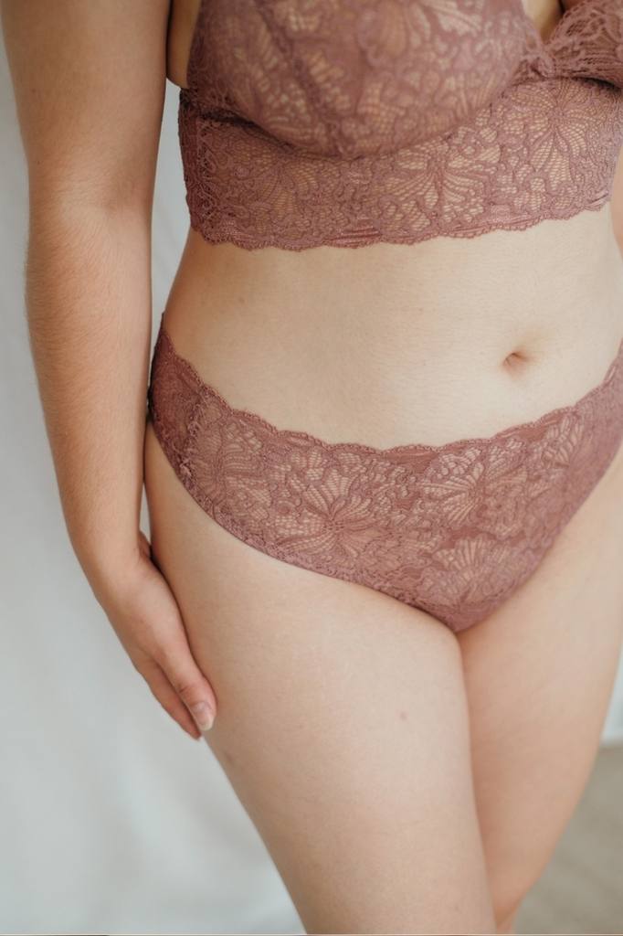 Close-up of Sting Belle in smockey rose on white skin. 