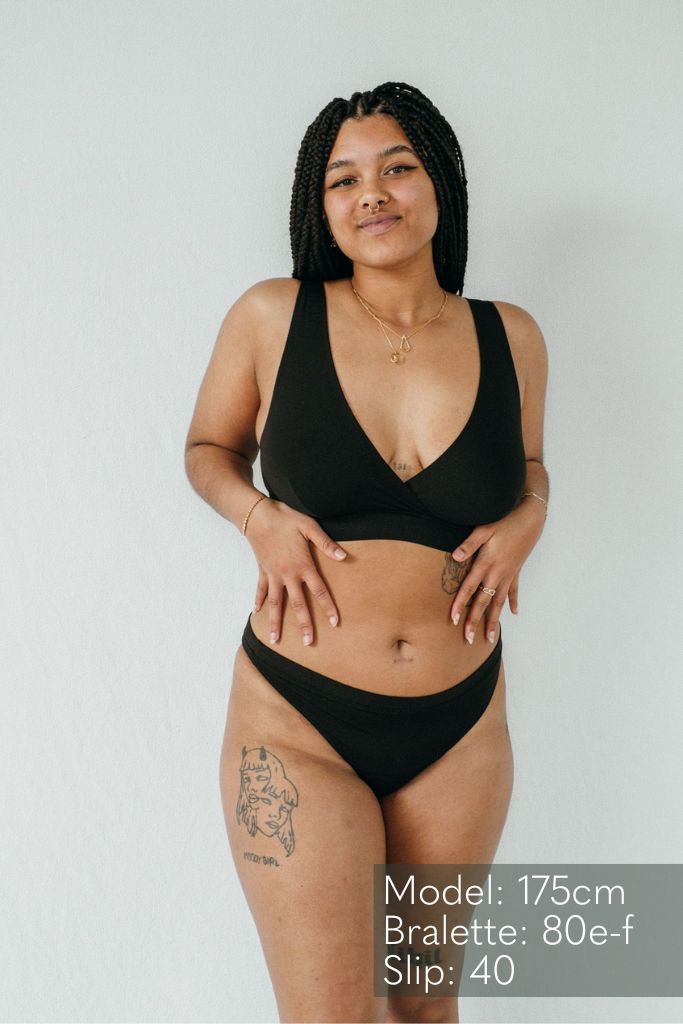 Woman with black hair wears basic underwear made of TENCEL Lyocell