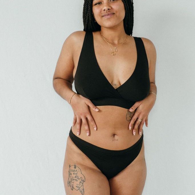 Standing woman wears chatting slip and Bralette made of Lyocell tencel