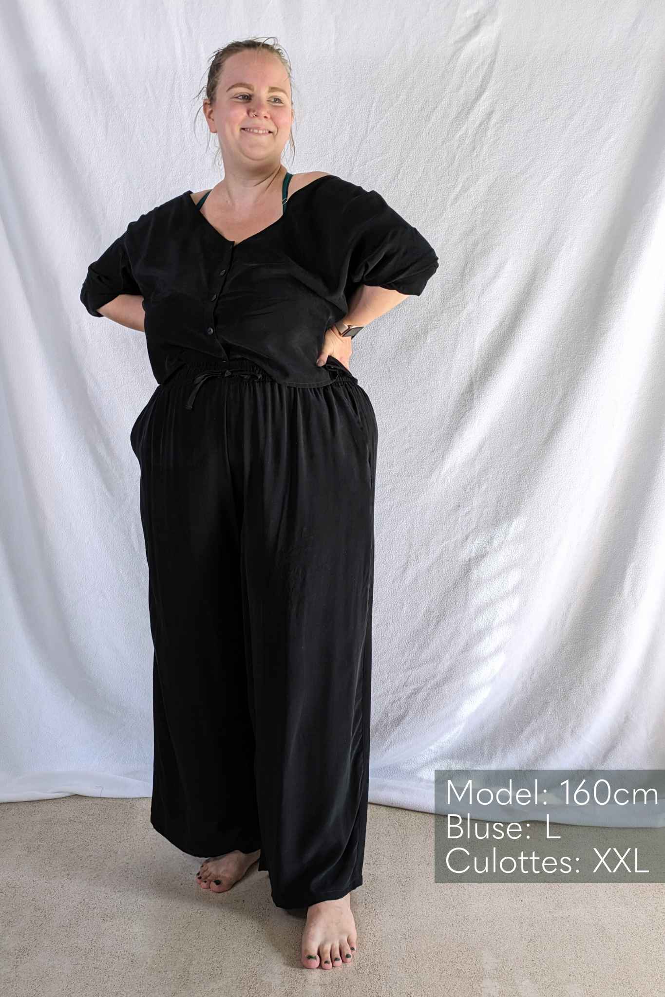 Model in front of white background wears pyjamas from thoughts of september