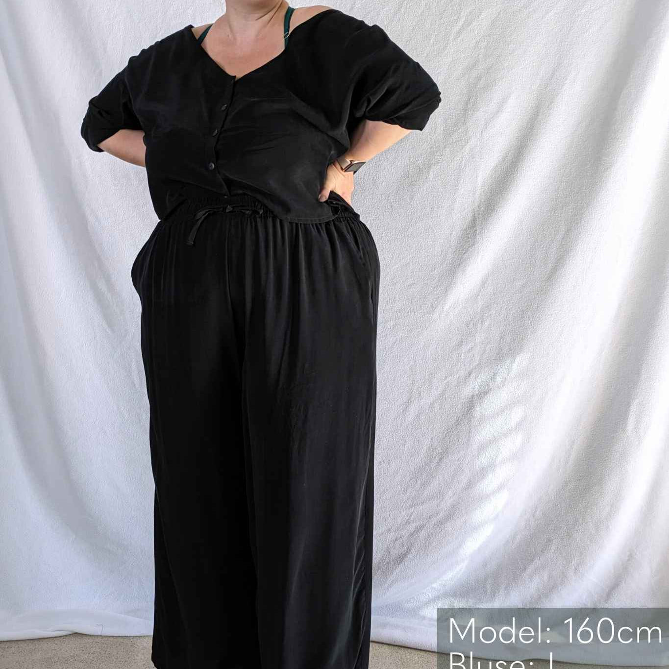 Model in front of white background wears pyjamas from thoughts of september