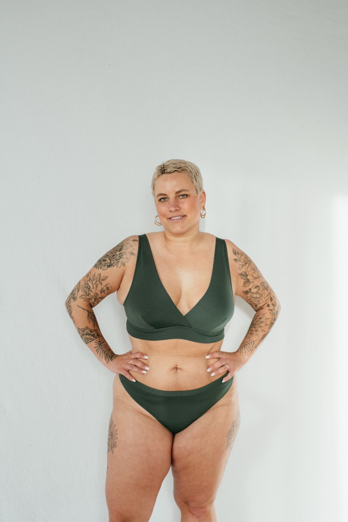 Basic underwear set made of Tencel in green, photographed from the front on a model. 