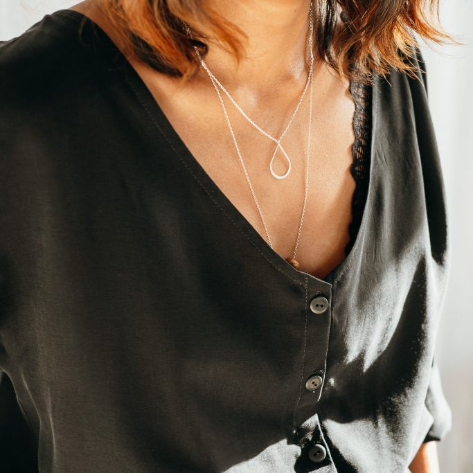 Close-up of the loose blouse Coco made of vegan silk.
