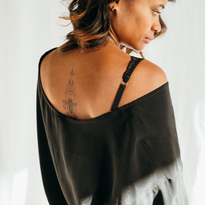 The Coco blouse falls loosely over the model's shoulders.