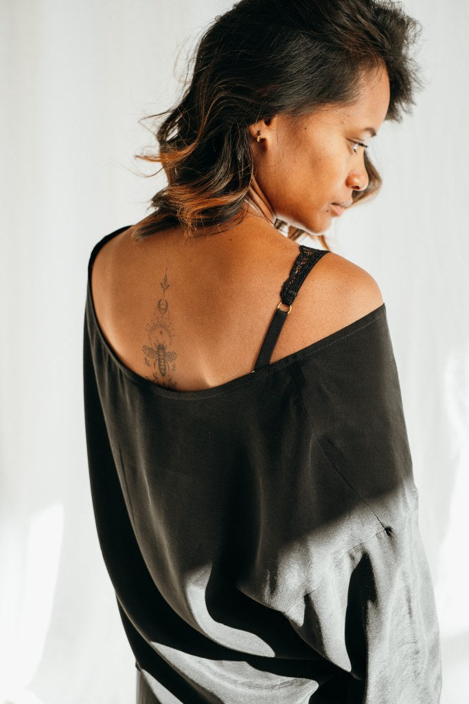 The Coco blouse falls loosely over the model's shoulders.