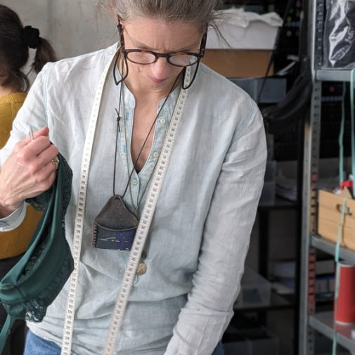 A woman considers the next step at a workshop