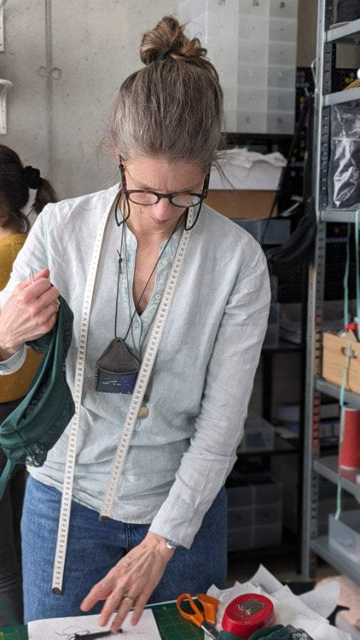 A woman considers the next step at a workshop