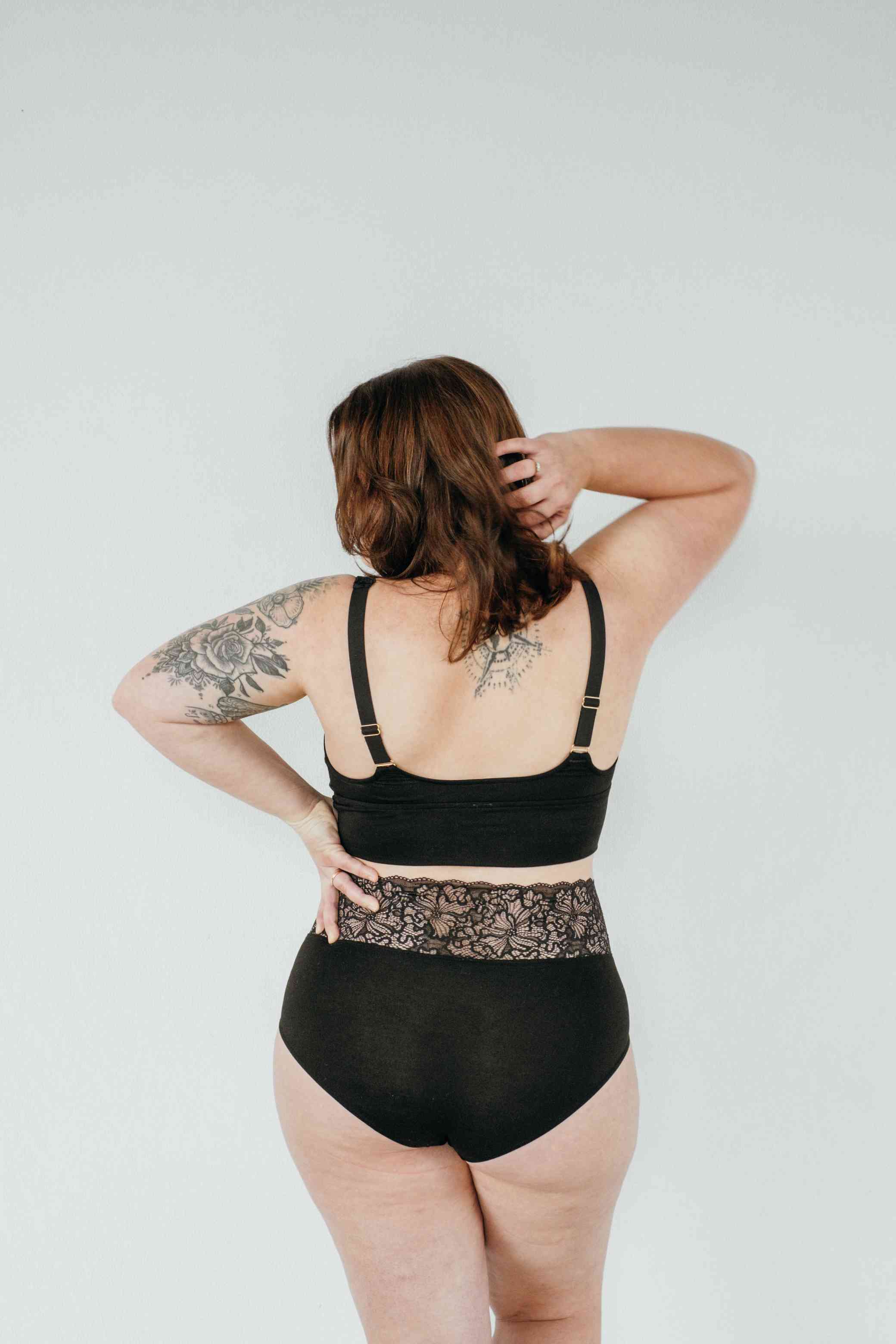 Rear view of Bralette for large breasts with high waist slip in black.