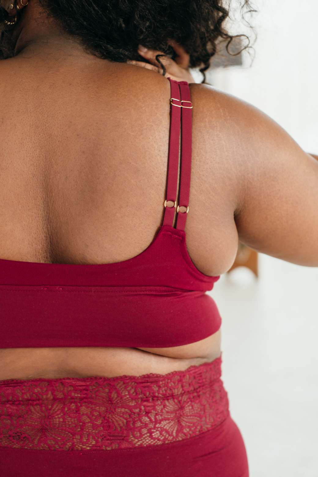 Close-up of the back of Bralette and matching slip in ruby red.