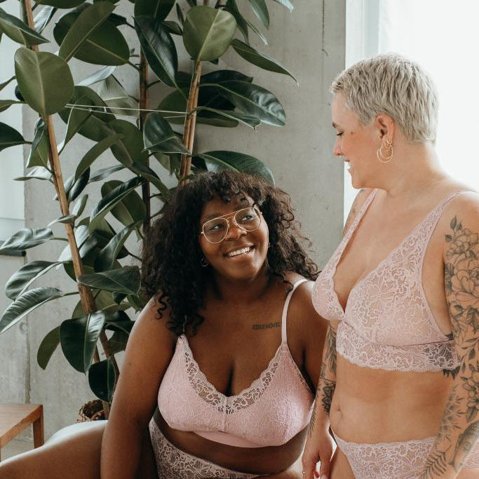 the two women pose in the Lana set and the Belle set in dahlia rose