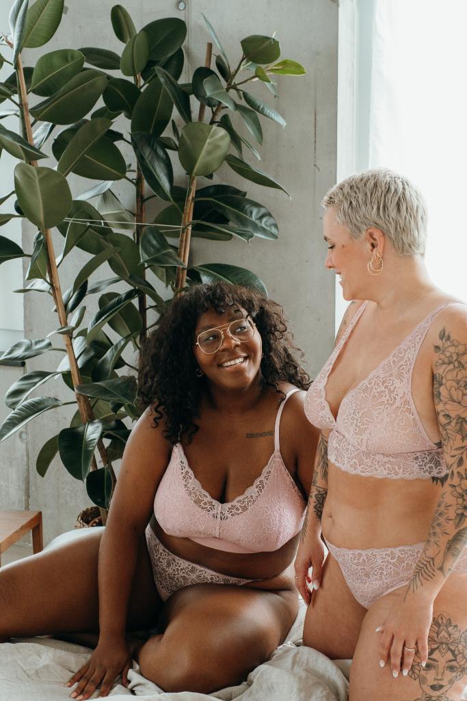 the two women pose in the Lana set and the Belle set in dahlia rose