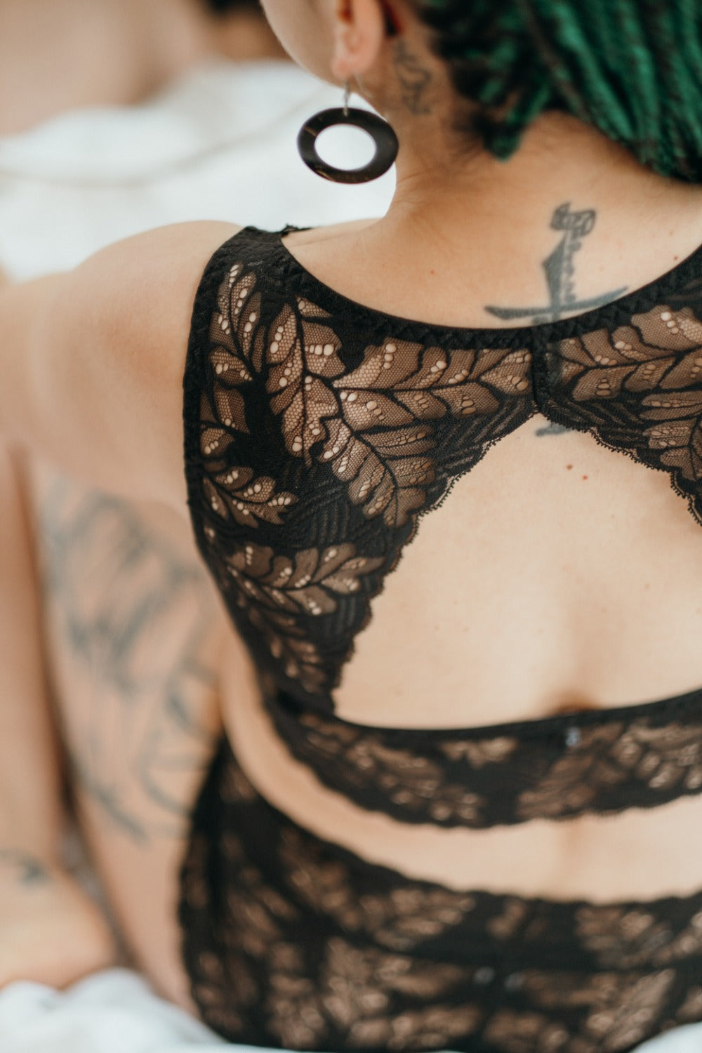 Back of woman in Bralette with special back in fine lace