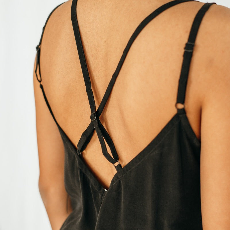 Detail view of the back neckline of the black cupro top.