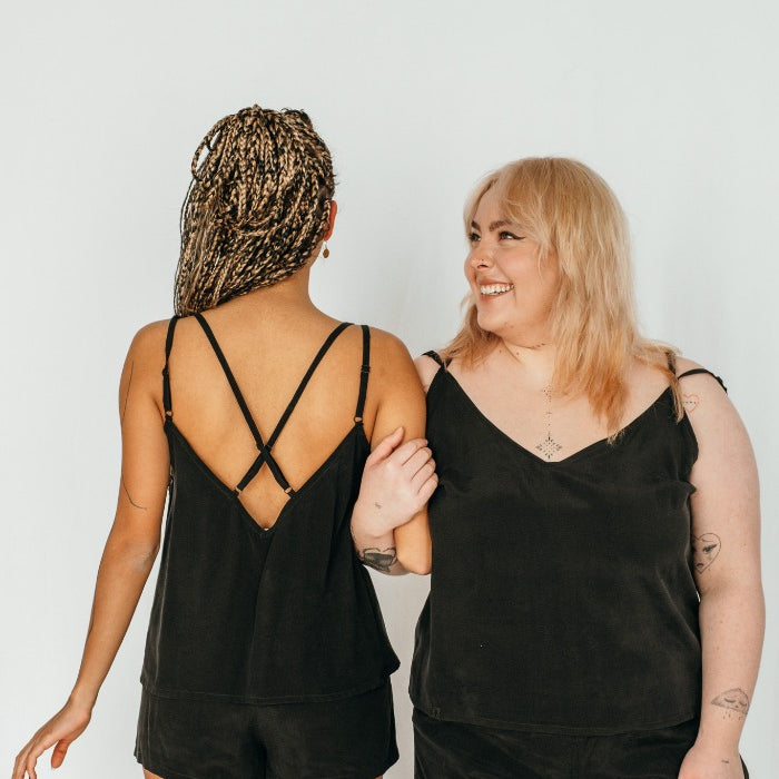 Two models both wear the same outfit: shorts and top Kat.