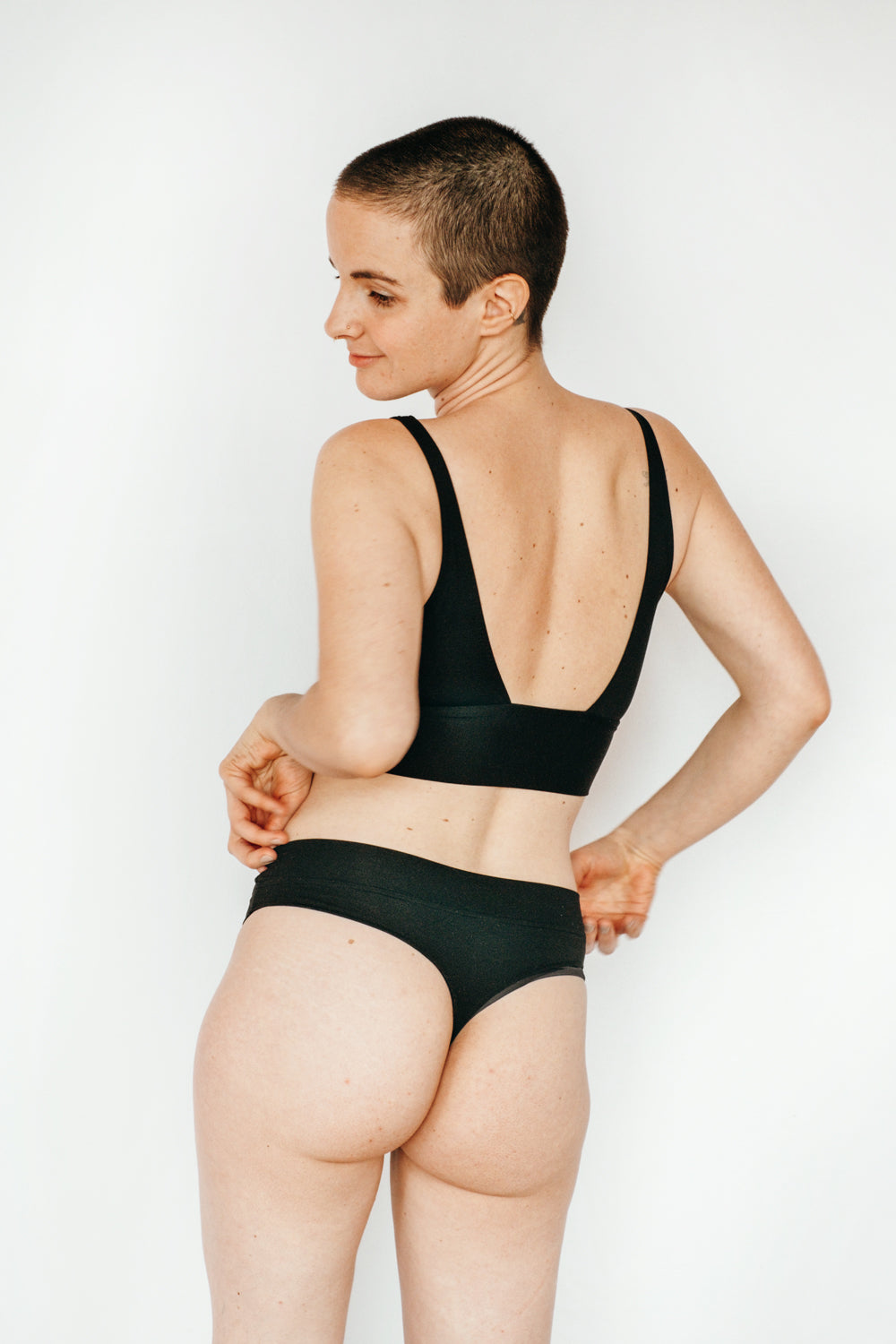 Person wears basic String and Bralette with a low-cut back